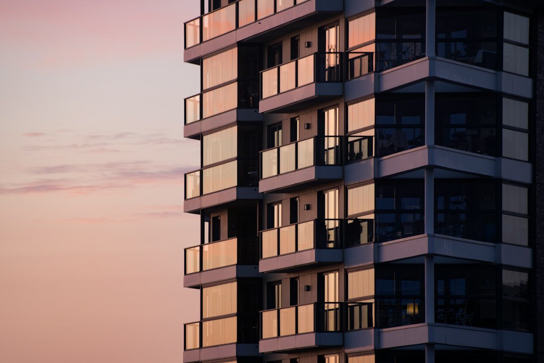 Exterior of an apartment building with glass-fronted balconies