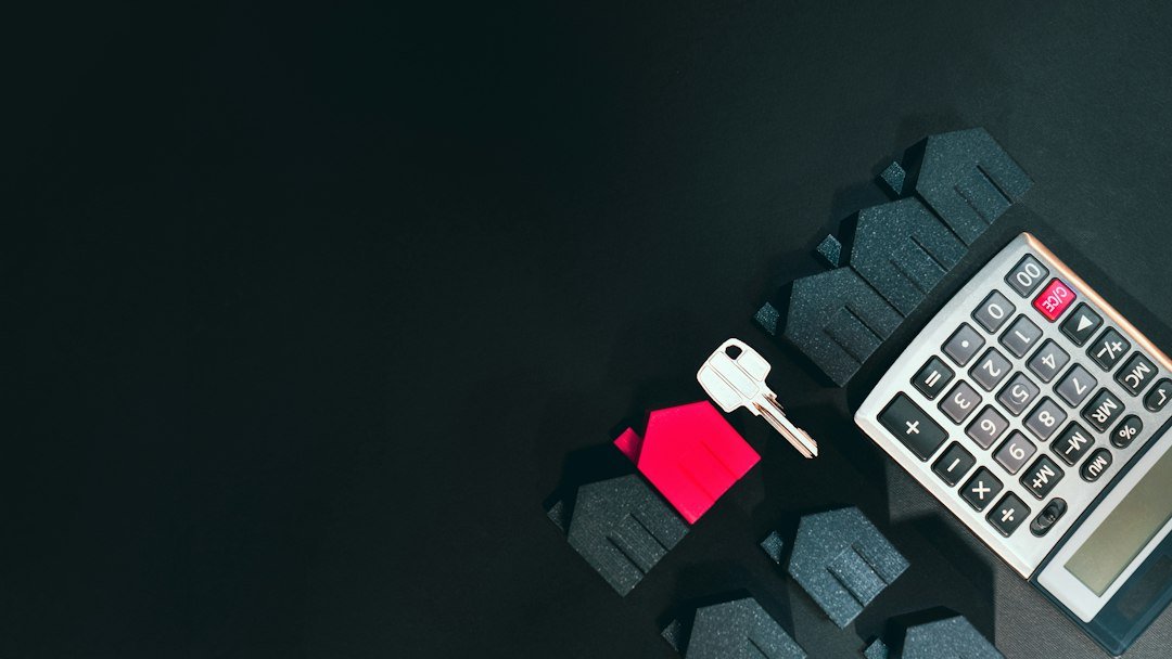 Calculator and house keys on a desk for planning a mortgage review before a fixed-rate deal ends